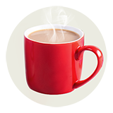 Steam rises from a red mug filled with coffee.