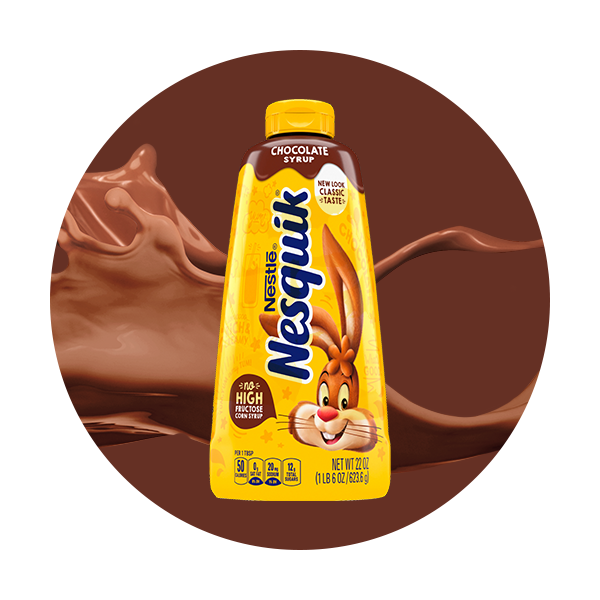 A bottle of chocolate syrup on a wave of chocolate milk inside a brown circle. 