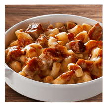 Dishes of chicken and BBQ pork Mac-FULLS™ on a wooden counter.