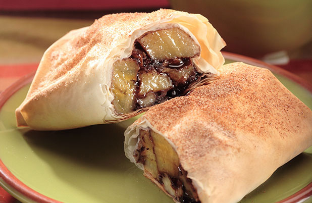 Baked chimichangas filled with bananas, cinnamon and chocolate.