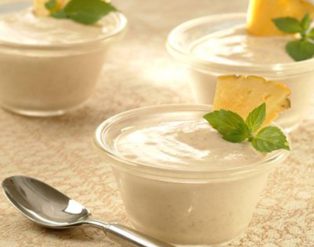 Clear dishes with creamy pineapple pecan filling, mint sprig.