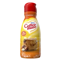 Photograph: Nestlé Coffee-mate hazelnut liquid creamer bottle with red cap