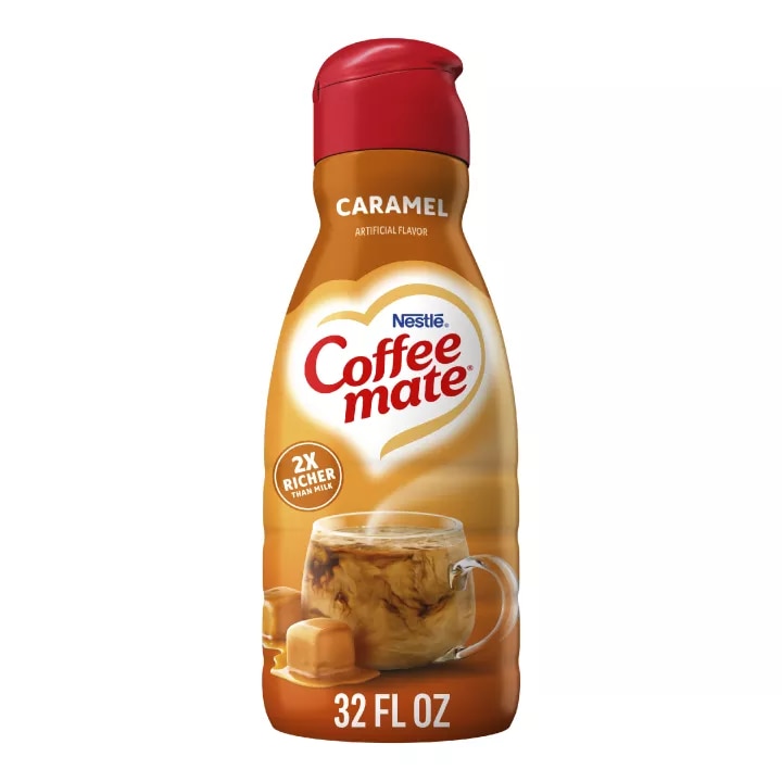 A bottle of Caramel Creamer with a red label above melting caramel squares and the product logo.