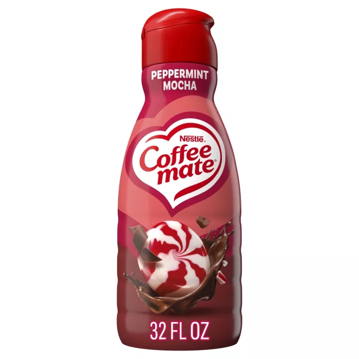 A red bottle of Peppermint Mocha Creamer with a coffee mug, chocolate chunks and peppermint bits under the Coffee mate logo.