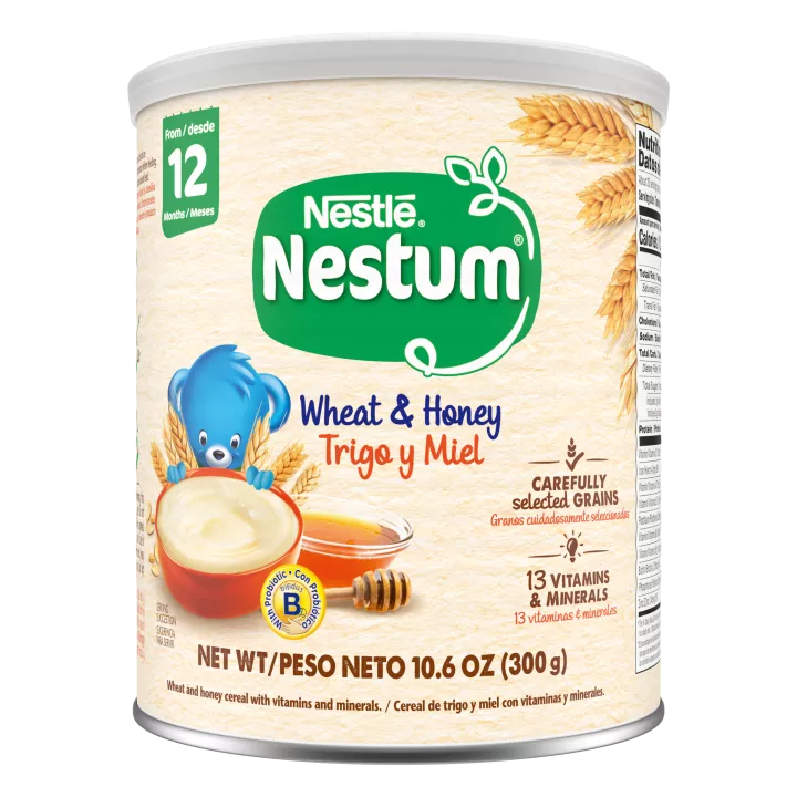 Front Center view of Nestum Wheat and Honey Cereal 10.6 oz Canister NET WT/PESO NETO 10.6 OZ (300g) product.