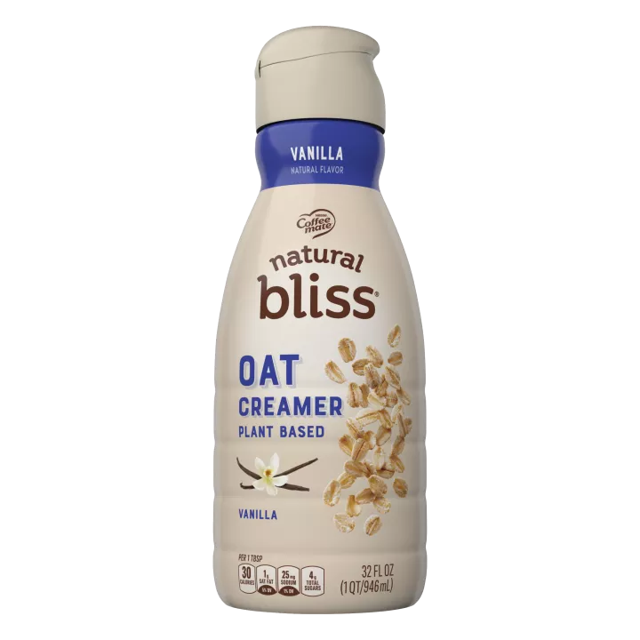 Botella marrón de Vanilla Flavored Oat Milk Creamer de natural bliss con una etiqueta azul sobre vainilla y avena.