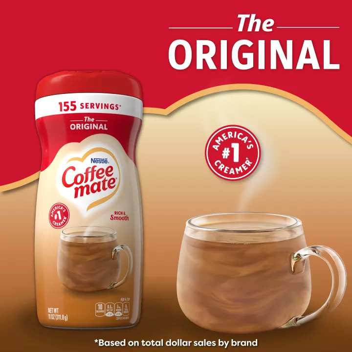 A canister of Coffee mate Original Powder with a red cap and red label above a mug of coffee with biscotti.