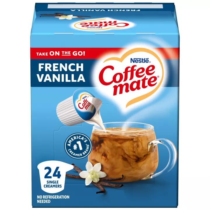 A blue box of single serve Coffee mate Vanilla Creamer with a blue label above coffee mug, vanilla bean and the product logo.