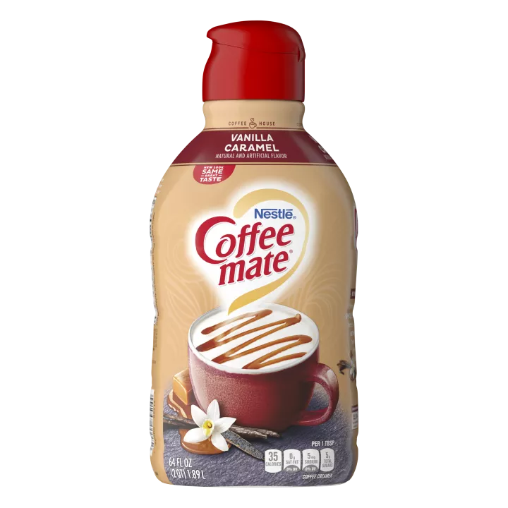 A bottle of Coffee mate Vanilla Caramel Powder with a coffee mug and melted caramel under the product logo.