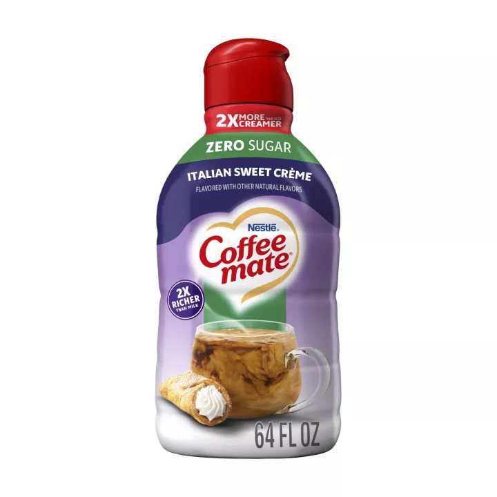 A purple bottle of Italian Sweet Crème Creamer with a green “Zero Sugar” label above a coffee mug and cannoli.
