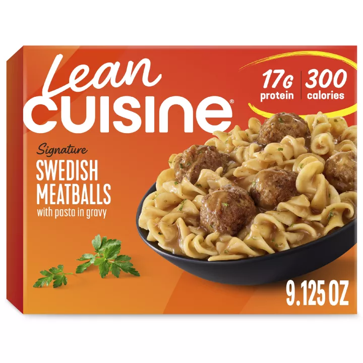 A box of Swedish Meatballs with a Protein Kick label near a bowl of meatballs and pasta covered with gravy.