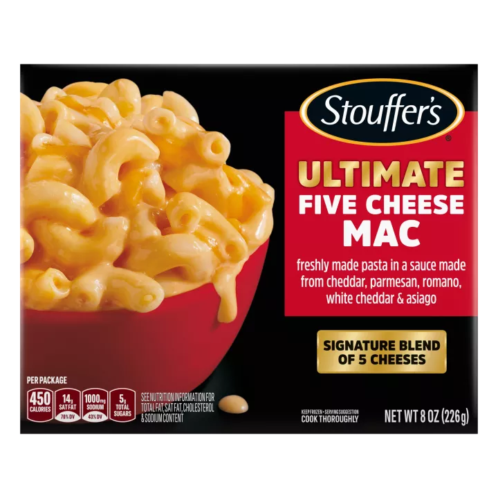 Box of Ultimate Five Cheese Mac with a Signature Blend of Five Cheeses label near a red bowl of cheesy macaroni and cheese.