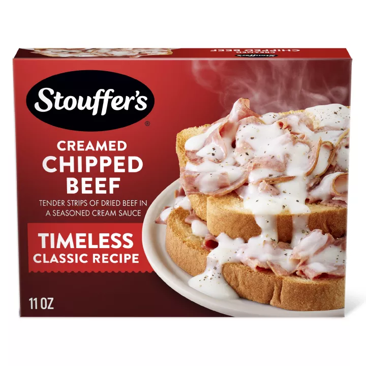Box of Creamed Chipped Beef with a dish of creamed beef beside a plate of toast with beef below the product name and logo.