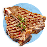 Close up of a grilled t-bone steak with a sprig of parsley as garnish, on a blue background.