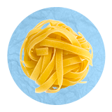 Close up of a ball of uncooked pasta, on a blue background.