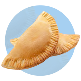 Two empanadas on a blue circle.