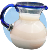 A pitcher of horchata on an orange circle.