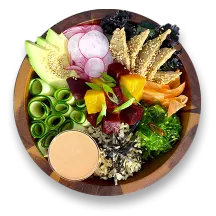 A wooden bowl filled with vegan poke with sesame seitan.