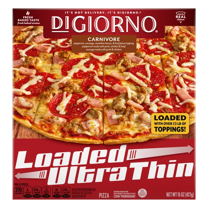 Box of DiGiorno Loaded Ultra Thin Carnivore Pizza on a cutting board & Loaded Ultra Thin logo.