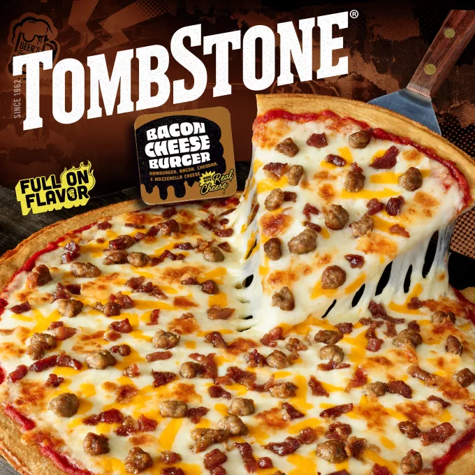 Package of Bacon Cheeseburger pizza with an image of a spatula under a slice of freshly made pizza, with the Tombstone logo and quarter pound of cheese and bold and zest sauce badges.