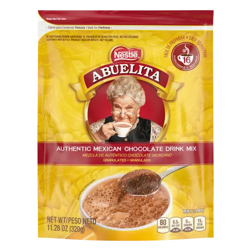 A yellow pouch with red labels and a spoon stirring hot chocolate mix into a yellow mug below the Abuelita logo.