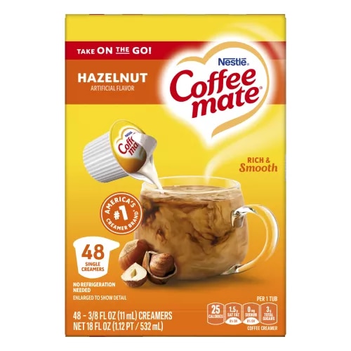 Vista frontal central de NESTLE COFFEE MATE Hazelnut Tubs 48x0.375 floz (11 mL) PESO NETO 18 FL OZ (1.12 PT / 532 mL).