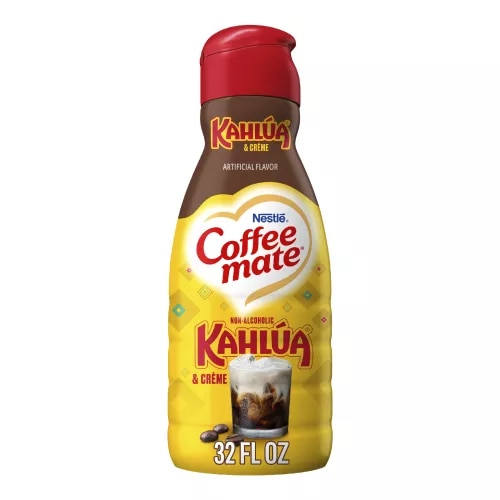 A yellow bottle of Kahlúa & Créme flavored coffee creamer with the Kahlúa logo above a glass of coffee with cream.