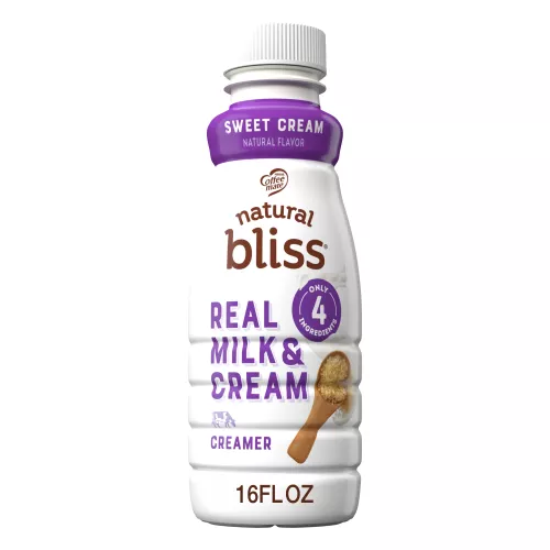 A white bottle of natural bliss Sweet Cream Creamer with a purple label above dairy pitchers and the product name.