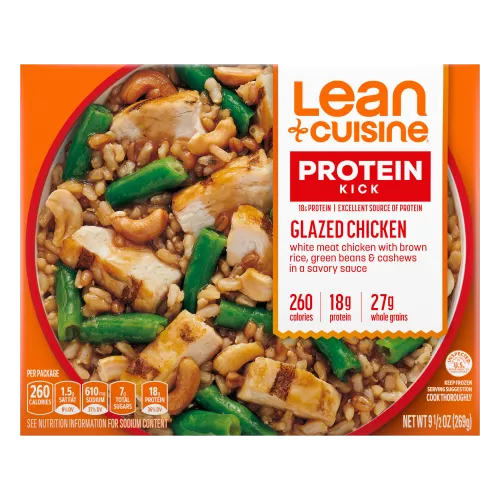 A box of Glazed Chicken with Protein Kick label with 260 calories, 18 grams of protein and 27 grams of whole grains near a bowl of grilled chicken, rice, green beans, and cashews.