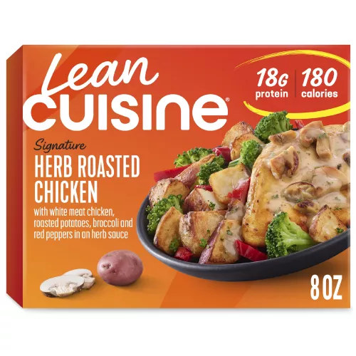 A box of Herb Roasted Chicken with a Protein Kick label near a bowl of chicken with mushroom sauce, broccoli, and potatoes.