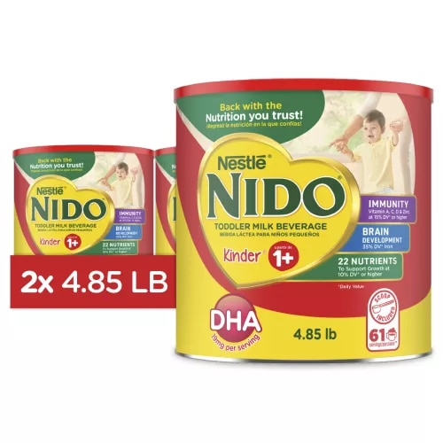 A canister of NIDO 1+ with a red label and a young boy near a badge that reads “immunity, Vitamins A, C, & D, Iron, & Zinc.”