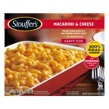 Box of Macaroni & Cheese with a dish of mac & cheese on a table under the product name and "100% REAL CHEESE" label.
