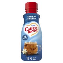 A blue bottle of Coffee mate French Vanilla Creamer with a red cap and blue label above a mug of coffee and vanilla beans.