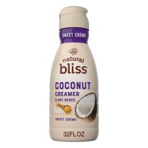 Una botella beige de creamer Coconut Sweet Creme de natural bliss con una etiqueta morada encima del nombre del producto y un coco.