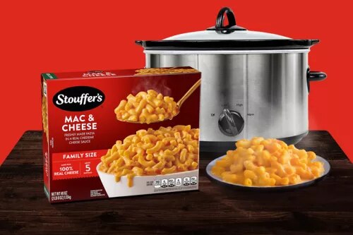 Photograph: Stouffer's Mac &amp; Cheese box, bowl of macaroni, and stainless slow cooker on red