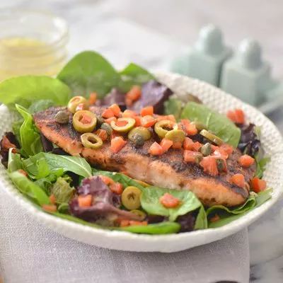 Veracruz Style Salmon on a Bed of Greens