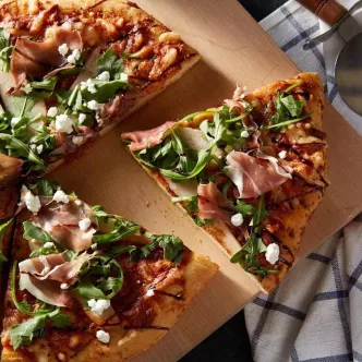 Cheese Pizza with Pears, Arugula, Prosciutto & Goat Cheese