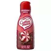 A red bottle of Peppermint Mocha Creamer with a coffee mug, chocolate chunks and peppermint bits under the Coffee mate logo.