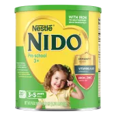 A canister of Nido 3+ with an “immunity, Vitamins A, & D, Iron, and Zinc” badge near a young girl smiling and pointing.