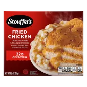 Box of Fried Chicken with a plate of chicken, mashed potatoes and gravy beside the product name and STOUFFER'S logo.
