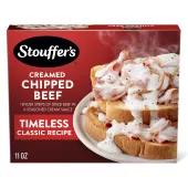 Caja de Creamed Chipped Beef con una fuente de carne a la crema junto a un plato de tostadas con carne debajo del nombre del producto y del logo.
