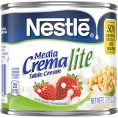 A can of Media Crema lite table cream with a green label featuring strawberries, a bowl of macaroni, and cream.