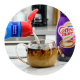 Creamer pours from a bottle into a mug of coffee on a counter near another bottle of creamer.