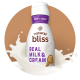 Creamer que salpica alrededor de un frasco de creamer Sweet Cream natural bliss.